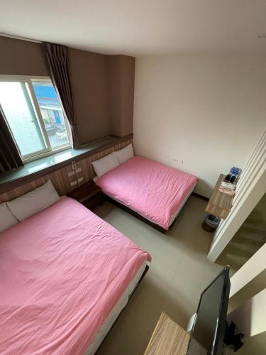 Ένα ή περισσότερα κρεβάτια σε δωμάτιο στο The Sunny Homestay