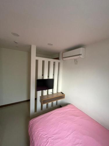 Ένα ή περισσότερα κρεβάτια σε δωμάτιο στο The Sunny Homestay