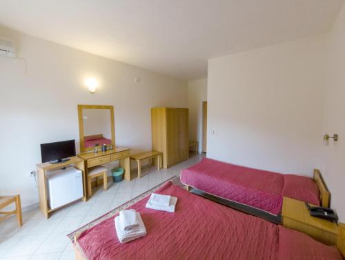 Ένα ή περισσότερα κρεβάτια σε δωμάτιο στο Hotel Kastro