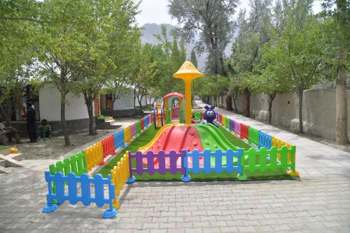a toy train on a playground in a park at APEX Le Yurt Skardu in Skardu