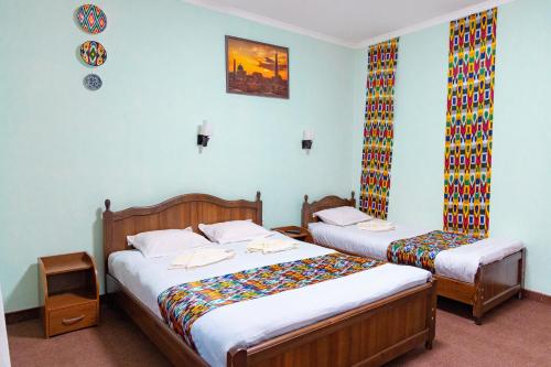 Ένα ή περισσότερα κρεβάτια σε δωμάτιο στο Shakh Sultan