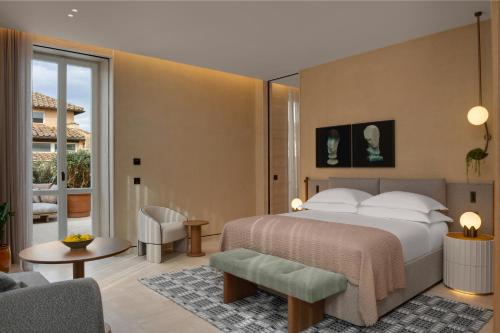a bedroom with a bed and a living room at Six Senses Rome in Rome
