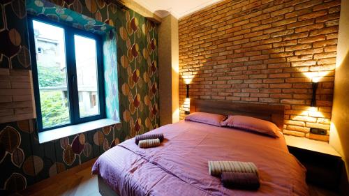 Ένα ή περισσότερα κρεβάτια σε δωμάτιο στο Anbani Apartments - City Center
