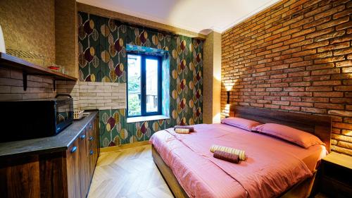 Ένα ή περισσότερα κρεβάτια σε δωμάτιο στο Anbani Apartments - City Center