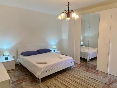 a bedroom with a large bed and a mirror at Ramona Home in Gallipoli
