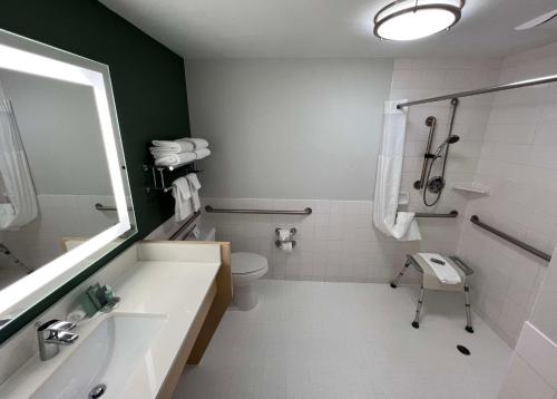 a bathroom with a sink and a toilet and a shower at Best Western Portland West Beaverton in Portland