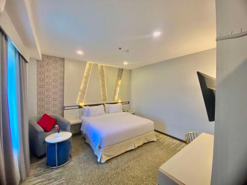 Un pat sau paturi într-o cameră la Best Western Batang Garing