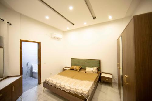 En eller flere senge i et værelse på RESIDENCE TERANGA immo luxe
