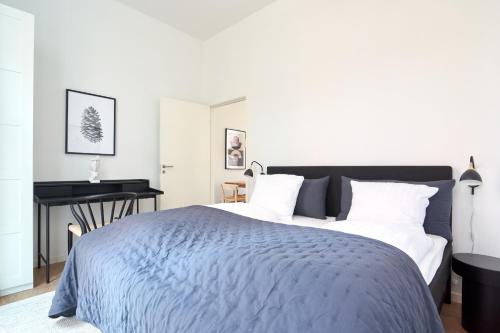 a bedroom with a bed and a piano at Great Apt · Near Beach · CPH in Copenhagen