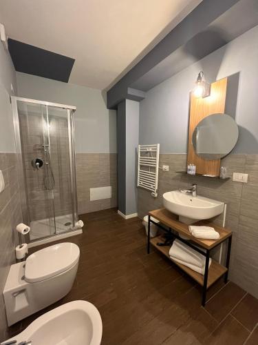 a bathroom with a toilet and a sink and a shower at Unico Studios in Milan