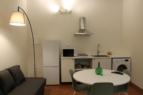 a living room with a table and a couch at Friends of Michelangelo in Florence