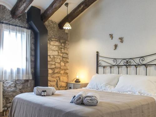 Säng eller sängar i ett rum på La Botigueta de Bellmunt