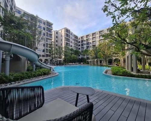a swimming pool with a slide in a building at La Casita HuaHin by Tasing in Hua Hin