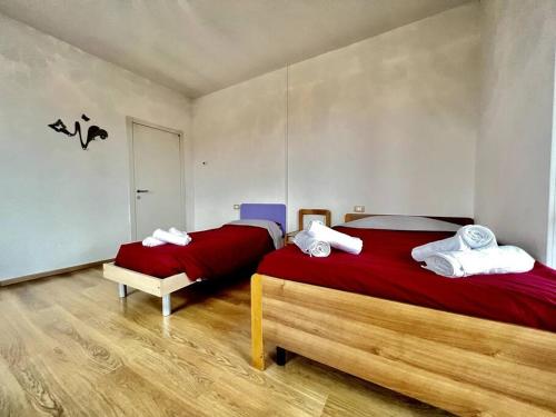 Voodi või voodid majutusasutuse Villetta famigliare a 10 minuti dal lago toas