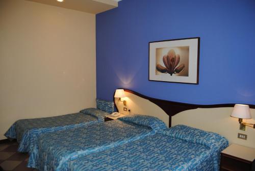 Hotel La Feniceにあるベッド