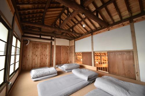 Postel nebo postele na pokoji v ubytování Dive INN Kiryu
