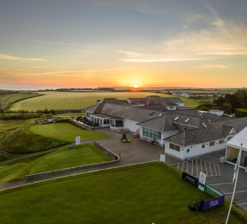 an aerial view of a house with a yard at Trevose Golf and Country Club in Padstow