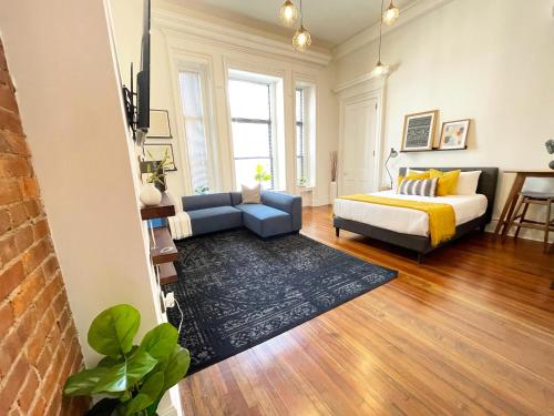 a living room with a bed and a couch at New Haven Stays in New Haven