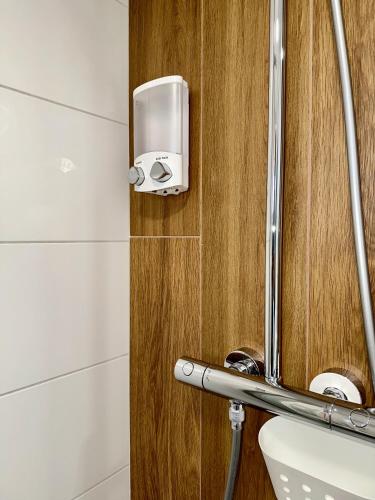 a bathroom with a shower with a toilet and a mirror at Residenza 1930 in Matera