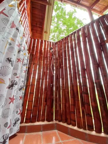 a window with brown curtains in a room at La Bota del Gigante in Gigante