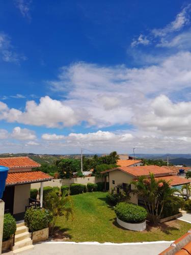 a view of a house with a yard at Pousada Vale Encantado in Serra de São Bento