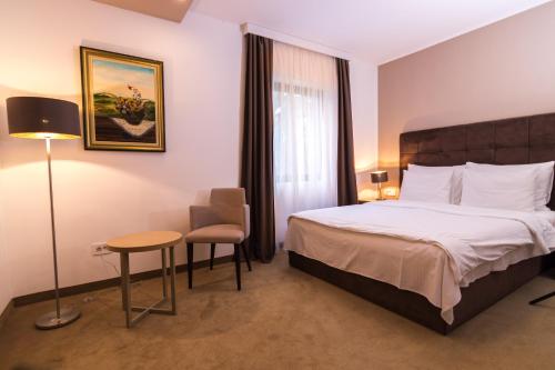 Ένα ή περισσότερα κρεβάτια σε δωμάτιο στο Miznah Hotels & Resorts
