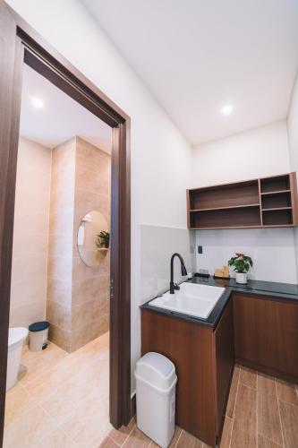 a bathroom with a sink and a toilet at GREENECO DA LAT HOTEL - Khách sạn Green Eco Đà Lạt in Da Lat