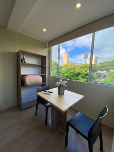 a room with a table and chairs and a window at Los Jacintos Villa Sarita Posadas - 1A in Posadas