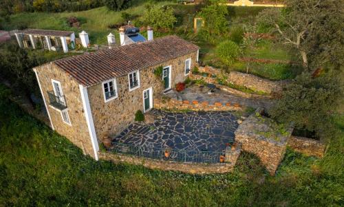 an aerial view of a stone house with a yard at Quinta Castanheiro da Penha - Alegrete - Portalegre - Alentejo in Alegrete