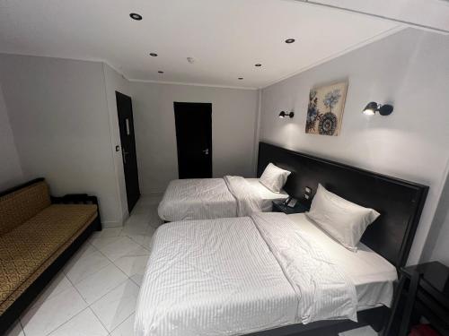 Helio Cairo Hotelにあるベッド