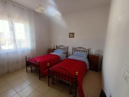 Ein Bett oder Betten in einem Zimmer der Unterkunft Casa di Rossella