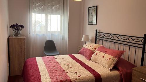 Posteľ alebo postele v izbe v ubytovaní APARTAMENTO A PIE DE PLAYA