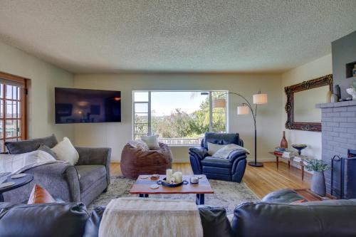 a living room with couches and a table at Charming Spring Valley Retreat with Private Pool! in Spring Valley