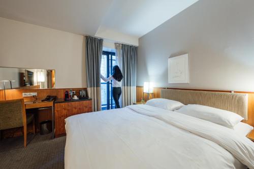 Ένα ή περισσότερα κρεβάτια σε δωμάτιο στο Peakture Hotel