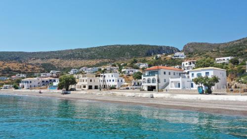 a view of a beach with white houses at Beachfront House Agia Pelagia Kythira in Agia Pelagia Kythira