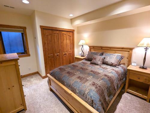 a bedroom with a large bed and two night stands at Eagles Nest at Elk Highlands in Whitefish