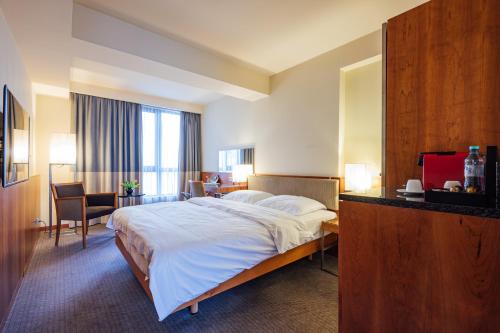 Ένα ή περισσότερα κρεβάτια σε δωμάτιο στο Peakture Hotel