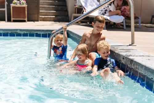 a group of children in a swimming pool at Snow King Resort in Jackson