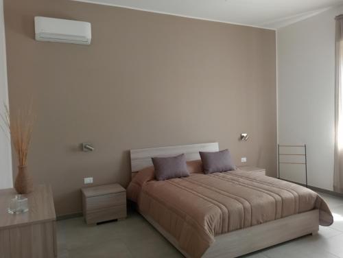 A bed or beds in a room at Scogliera apartments