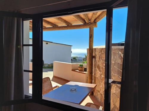 a view of a room with a table and a window at Apartamento Valentina in Tías