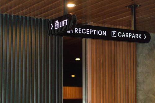 a street sign in a building with aervation car park at Bagan Suite in Butterworth