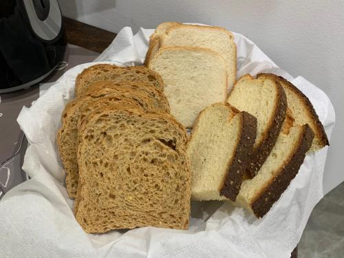 four slices of bread sitting on a paper at B&B D'Amari Affittacamere in Palermo