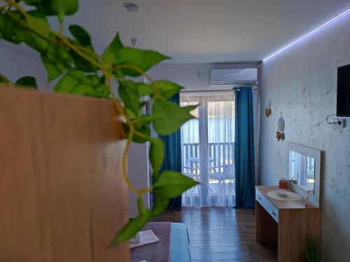 a bathroom with a sink and a mirror at Adonis in Ostrovo