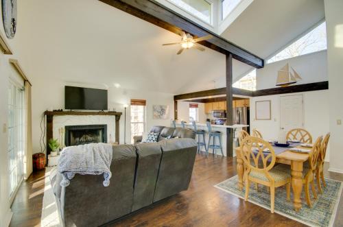 a living room with a couch and a table at Furnished Porch! Margaritaville Resort Family Stay in Osage Beach