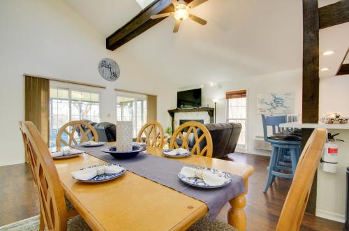 a dining room with a wooden table and chairs at Furnished Porch! Margaritaville Resort Family Stay in Osage Beach
