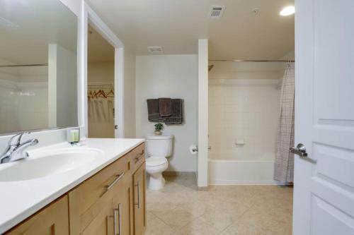 a bathroom with a sink and a toilet and a shower at Fantastic 2 BR Condo At Pentagon City With Gym in Arlington