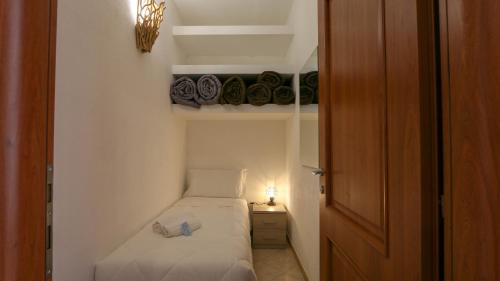En eller flere senger på et rom på Casa Vacanze Sas Tancas