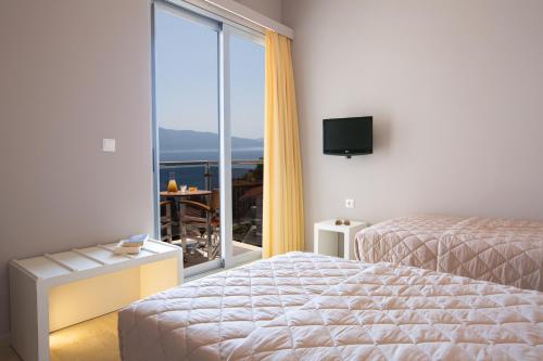 Postel nebo postele na pokoji v ubytování Adriatica Hotel
