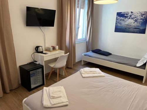 Una cama o camas en una habitación de Colombo 32 Affittacamere