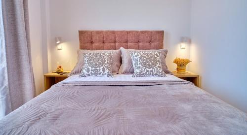 Postel nebo postele na pokoji v ubytování Sunflower Suites Gouvia Corfu